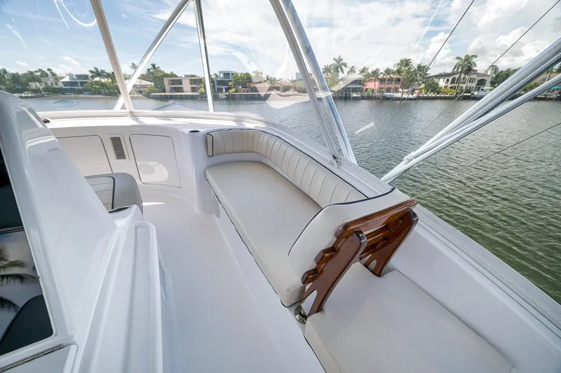 Slide: The Image of Luxurious seating area on 2021 Hatteras GT65 Carolina yacht, overlooking serene waterfront. - 24