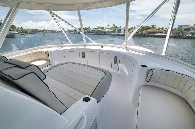 Slide: The Image of Luxurious interior of 2021 Hatteras GT65 Carolina yacht with waterfront view. - 25