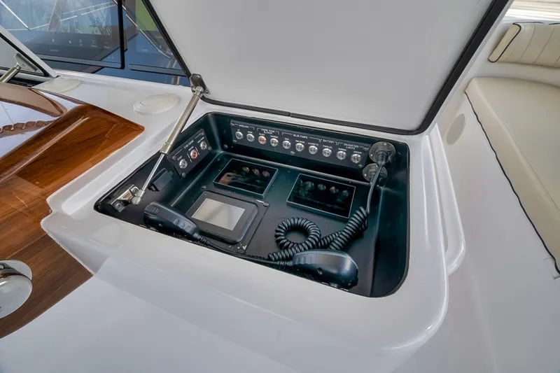 Slide: The Image of Control panel of 2021 Hatteras GT65 Carolina yacht with communication equipment. - 19