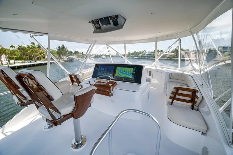 Slide: The Image of Luxurious helm of 2021 Hatteras GT65 Carolina yacht with advanced navigation system. - 21