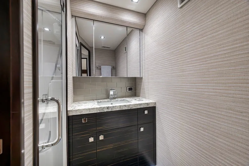 Slide: The Image of Luxurious bathroom interior of 2021 Hatteras GT65 Carolina yacht with modern fixtures. - 46