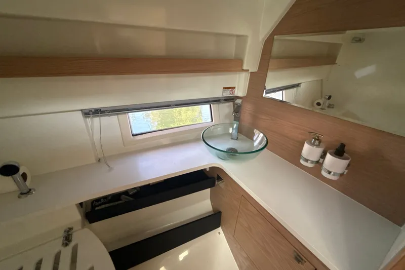 Slide: The Image of Modern bathroom interior of 2024 Quarken 35 Cabin Tourer with glass sink and wooden accents. - 24