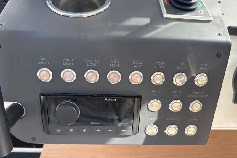 Slide: The Image of Control panel of 2024 Quarken 35 Cabin Tourer with various light and function buttons. - 17
