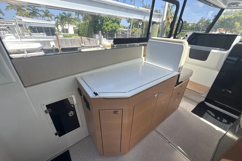 Slide: The Image of Interior of 2024 Quarken 35 Cabin Tourer, featuring sleek cabinetry and modern design elements. - 13