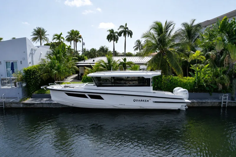 The Image of 2024 Quarken 35 Cabin Tourer docked by tropical waterfront home. - 0