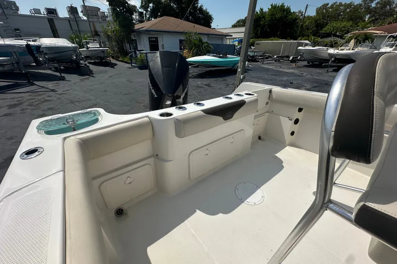 Slide: The Image of 2023 Sailfish 242 CC boat interior with seating and storage compartments. - 9