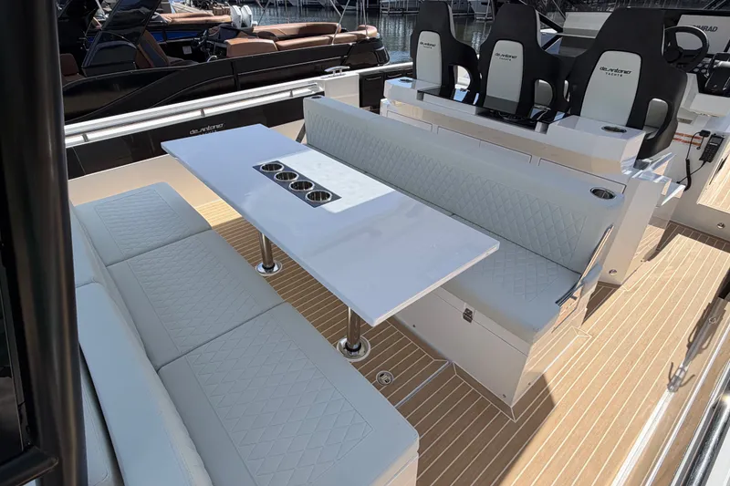 Slide: The Image of Luxurious seating area on 2027 De Antonio Yachts D32 with elegant table and cup holders. - 6