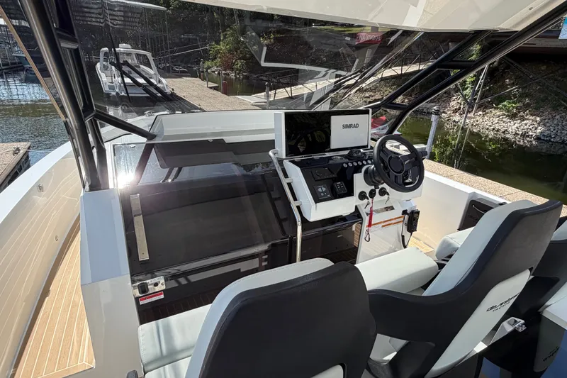 Slide: The Image of Interior view of 2027 De Antonio Yachts D32 cockpit with modern controls and steering. - 7