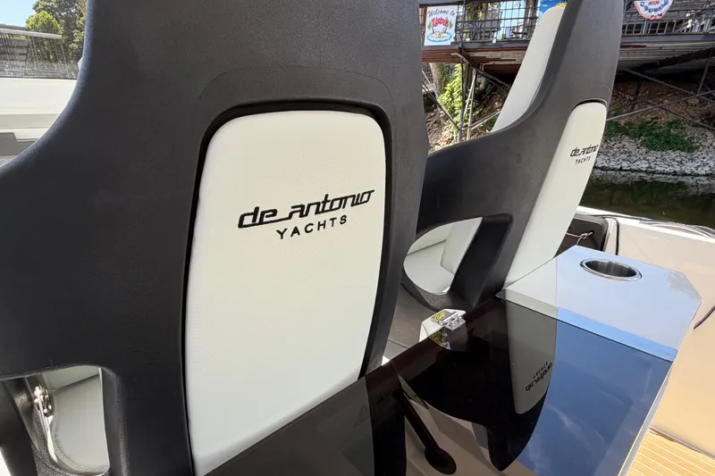Slide: The Image of Luxury seating on 2027 De Antonio Yachts D32, featuring sleek design and branding. - 8