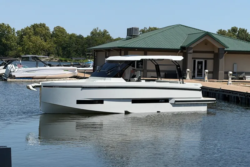 The Image of 2027 De Antonio Yachts D32 docked at a marina, featuring sleek modern design. - 1