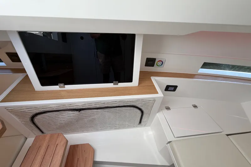 Slide: The Image of Interior of 2027 De Antonio Yachts D32, featuring modern wood and white design elements. - 17