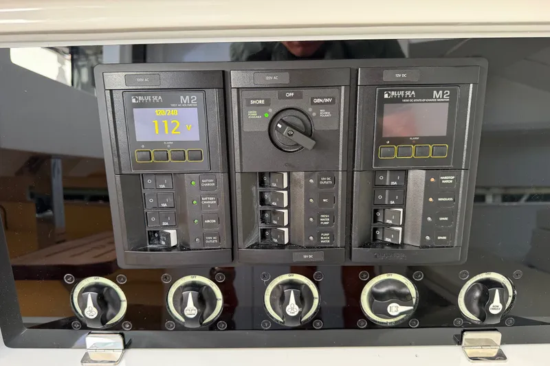 Slide: The Image of Control panel of 2027 De Antonio Yachts D32 with Blue Sea Systems M2 displays. - 14