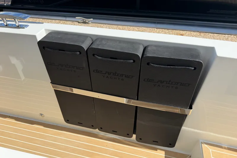 Slide: The Image of De Antonio Yachts D32 2027 boat fenders on deck, showcasing sleek design and functionality. - 11