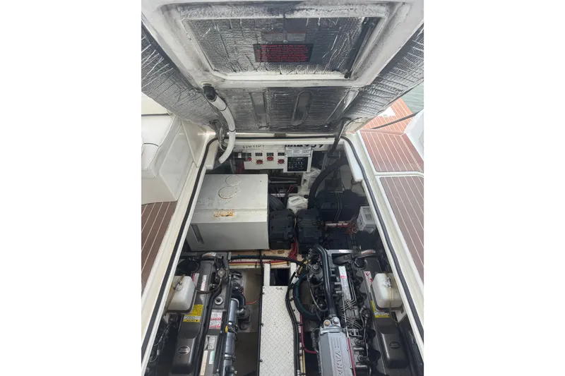 Slide: The Image of Engine compartment of 2006 Cruisers Yachts 370 Express, showcasing mechanical components and layout. - 34