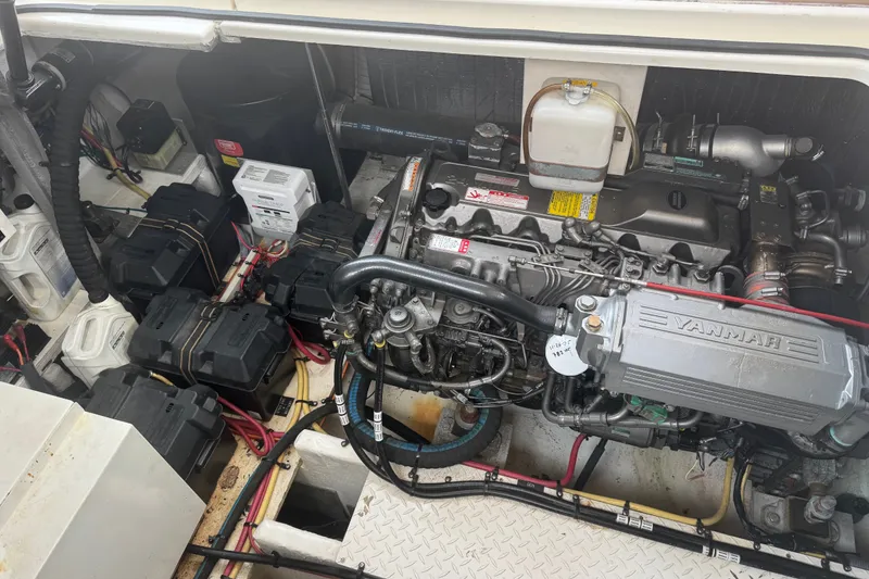 Slide: The Image of Engine compartment of a 2006 Cruisers Yachts 370 Express, featuring a Yanmar engine. - 35
