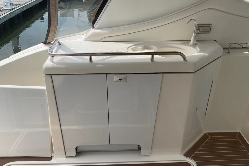 Slide: The Image of 2006 Cruisers Yachts 370 Express cockpit sink and storage area. - 15