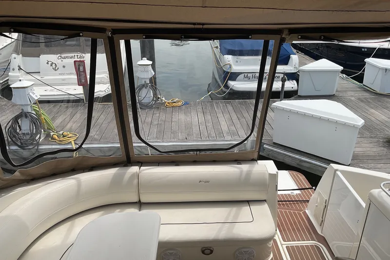 Slide: The Image of 2006 Cruisers Yachts 370 Express interior view at marina dock. - 12