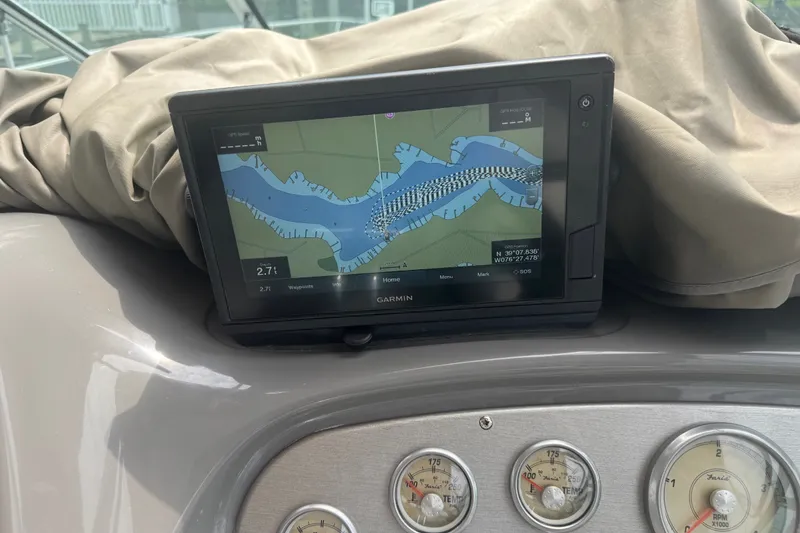 Slide: The Image of Garmin navigation system on 2006 Cruisers Yachts 370 Express dashboard, displaying a waterway map. - 18
