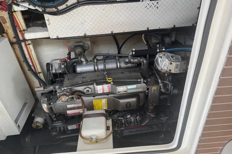 Slide: The Image of Engine compartment of a 2006 Cruisers Yachts 370 Express, showcasing mechanical components. - 37