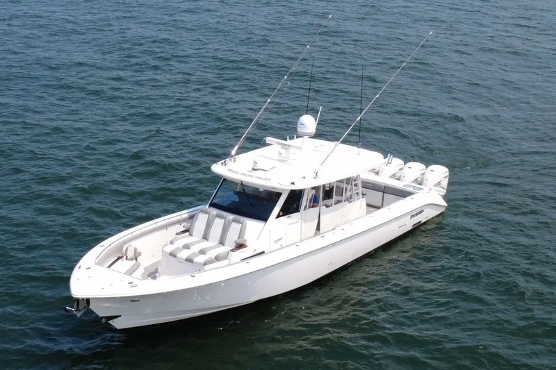 Slide: The Image of 2023 Everglades 455 Center Console boat on open water. - 2