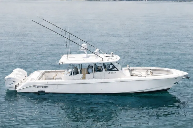 Slide: The Image of 2023 Everglades 455 Center Console boat on calm ocean waters. - 6
