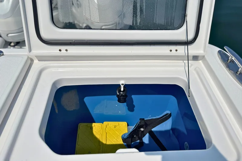 Slide: The Image of Open storage compartment on 2023 Everglades 455 Center Console boat. - 69
