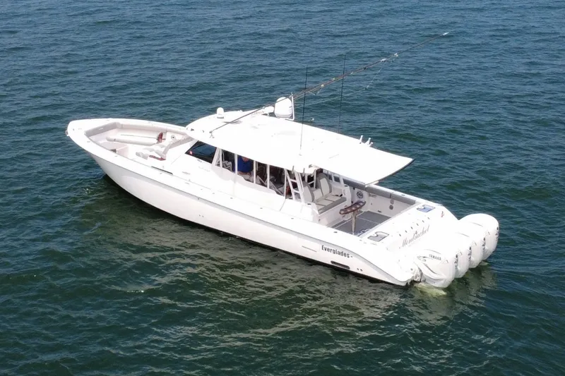 Slide: The Image of 2023 Everglades 455 Center Console boat on open water, featuring sleek design and powerful engines. - 3