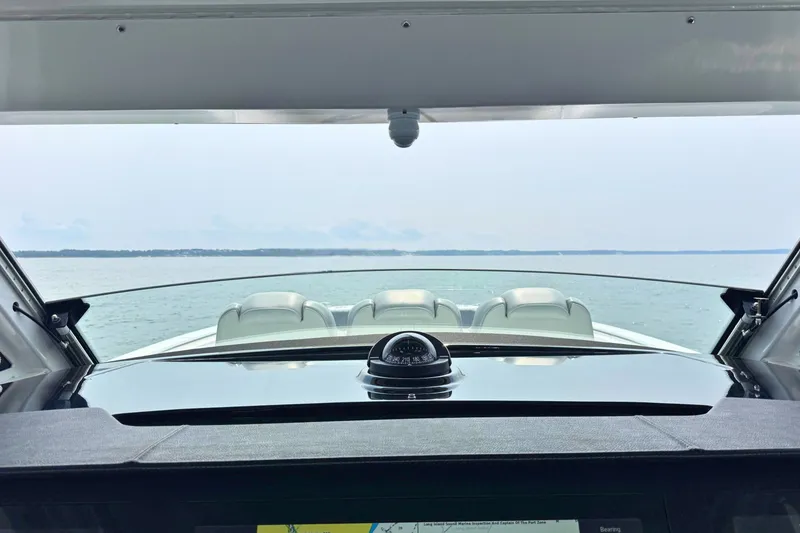 Slide: The Image of View from the helm of a 2023 Everglades 455 Center Console boat on open water. - 33