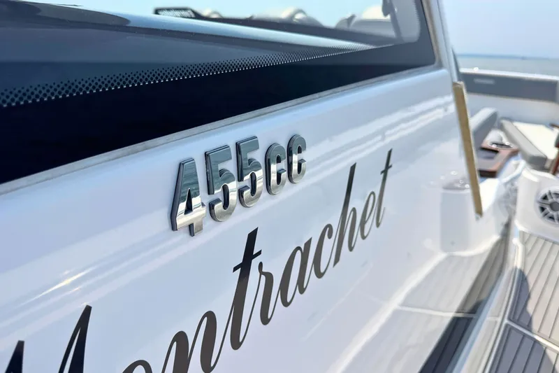 Slide: The Image of 2023 Everglades 455 Center Console boat with "455cc" and "Montrachet" text on the side. - 38