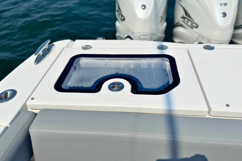Slide: The Image of 2023 Everglades 455 Center Console boat with livewell and powerful outboard engines. - 63