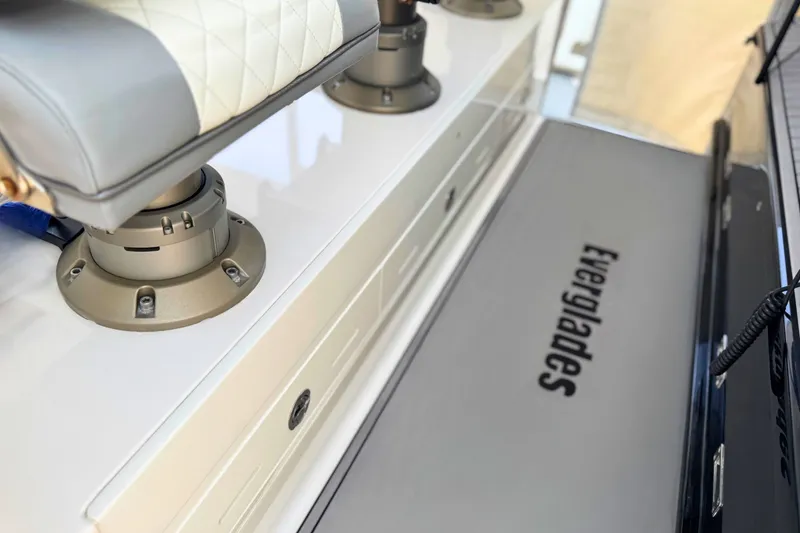 Slide: The Image of 2023 Everglades 455 Center Console boat interior with seating and branding. - 37