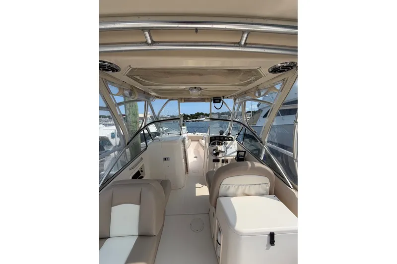 Slide: The Image of 2013 Grady-White Freedom 255 boat interior with helm and seating area. - 15