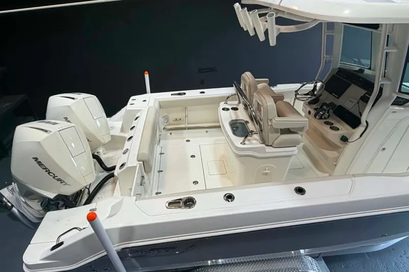 Slide: The Image of 2022 Boston Whaler 250 Outrage boat interior with dual Mercury engines. - 7