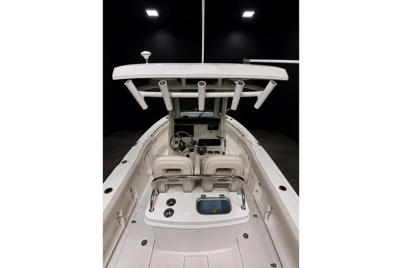 Slide: The Image of 2022 Boston Whaler 250 Outrage boat interior with helm and seating area. - 14