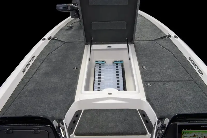 Slide: The Image of Manufacturer Provided Image: 2026 Skeeter ZXE21 boat deck with open storage compartment, featuring sleek design and ample space. - 6