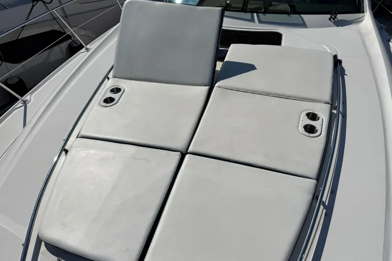 Slide: The Image of Sunpad on 2005 Sea Ray 48 Sundancer yacht, featuring cup holders and sleek design. - 25