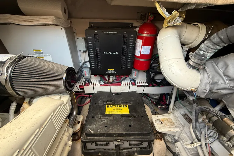 Slide: The Image of Engine room of 2005 Sea Ray 48 Sundancer with battery and fire extinguisher. - 107