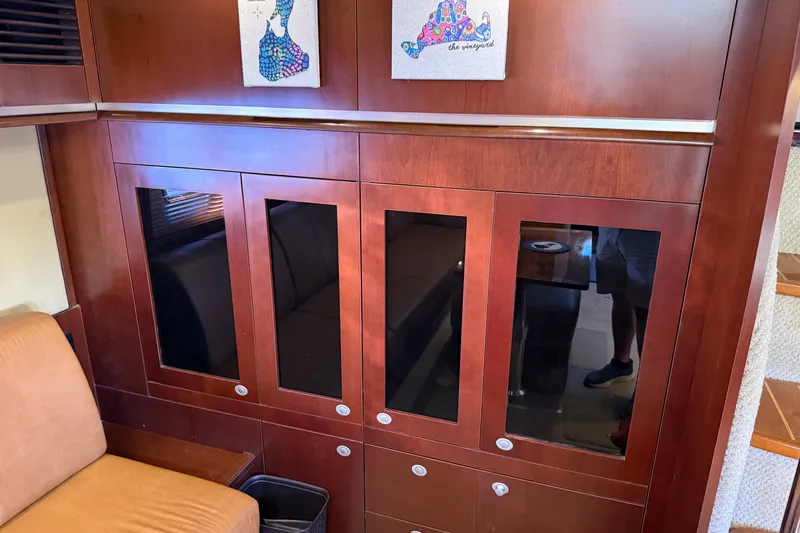 Slide: The Image of Luxurious wooden cabinetry inside a 2005 Sea Ray 48 Sundancer yacht interior. - 70