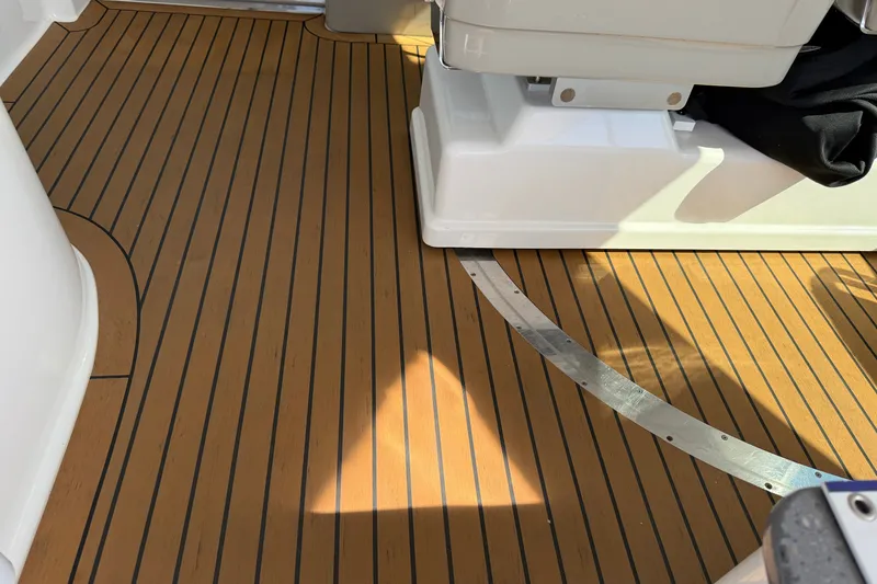 Slide: The Image of Teak deck of 2005 Sea Ray 48 Sundancer yacht, showcasing elegant wood finish. - 14