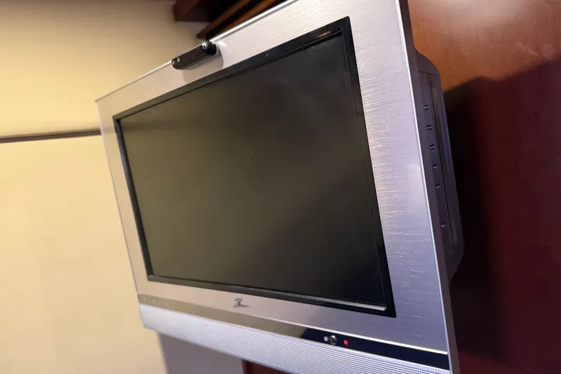 Slide: The Image of Flat-screen TV mounted on a 2005 Sea Ray 48 Sundancer yacht interior. - 97