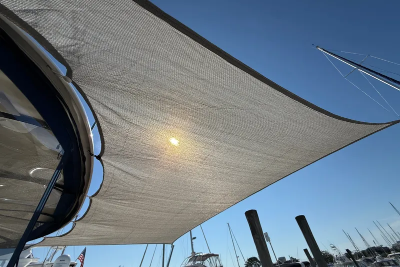 Slide: The Image of Sun shining through shade sail on 2005 Sea Ray 48 Sundancer yacht. - 13