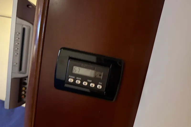 Slide: The Image of Thermostat control panel on 2005 Sea Ray 48 Sundancer yacht interior. - 96