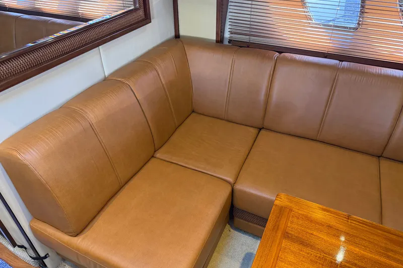 Slide: The Image of Luxurious leather seating in 2005 Sea Ray 48 Sundancer yacht interior. - 81