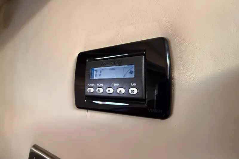 Slide: The Image of Thermostat control panel on 2005 Sea Ray 48 Sundancer yacht interior wall. - 53