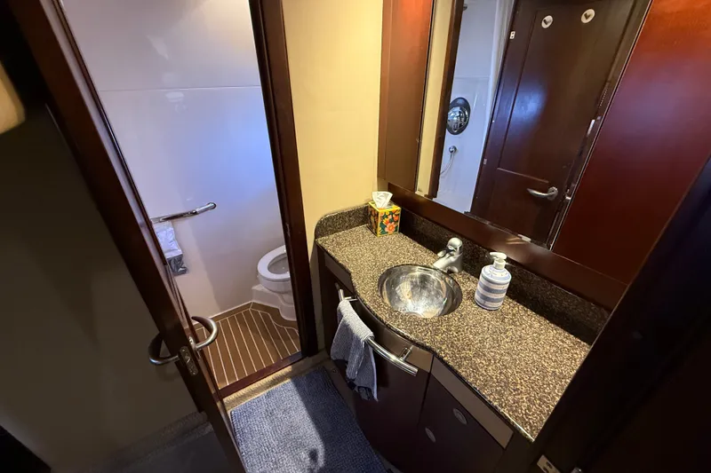 Slide: The Image of Bathroom interior of 2005 Sea Ray 48 Sundancer yacht with sink and toilet. - 90