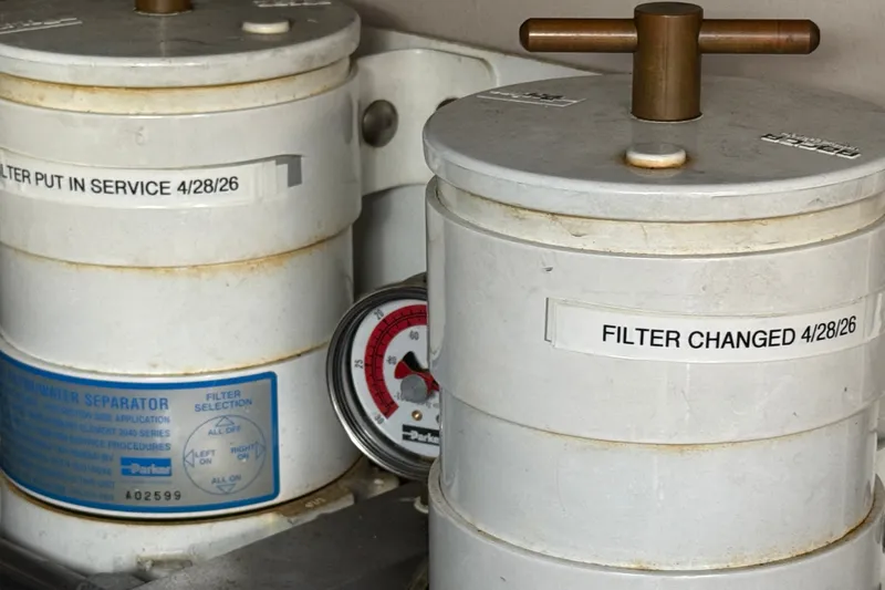 Slide: The Image of Fuel filter system with service dates on a 2005 Sea Ray 48 Sundancer yacht. - 111