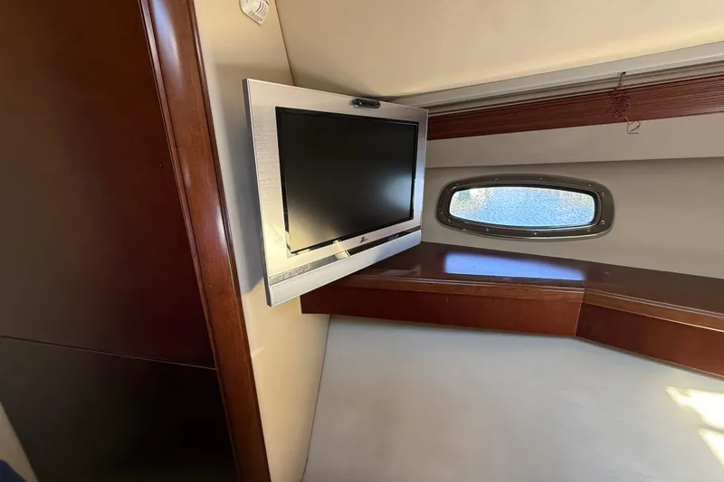Slide: The Image of Interior of 2005 Sea Ray 48 Sundancer with TV and porthole window. - 51