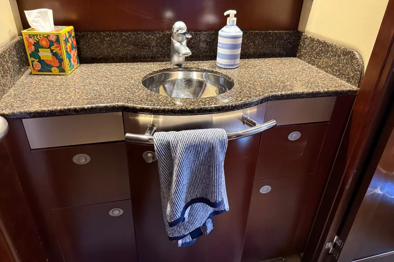 Slide: The Image of Luxurious bathroom sink area on a 2005 Sea Ray 48 Sundancer yacht. - 100
