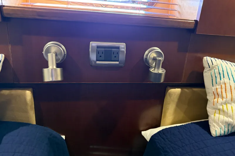 Slide: The Image of Interior of 2005 Sea Ray 48 Sundancer with wall lights and power outlet. - 98
