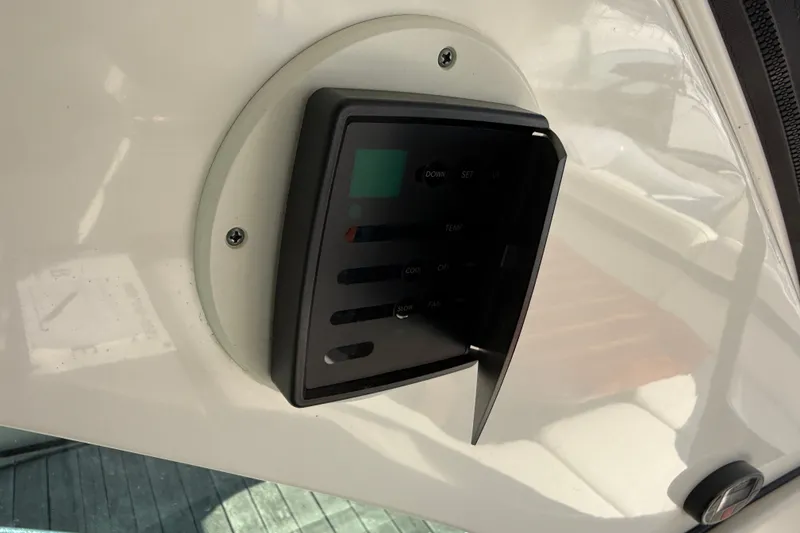 Slide: The Image of Control panel on a 2005 Sea Ray 48 Sundancer yacht, mounted on a white surface. - 20
